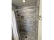 Stylish tiled shower featuring built-in niche and seating; neutral gray tile throughout at 5604 Stratford Ln, Lakeland, FL 33813