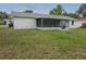 Spacious backyard featuring a screened in patio at 6131 Doe E Cir, Lakeland, FL 33809