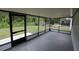 The screened in patio offers views of the spacious, green backyard at 6131 Doe E Cir, Lakeland, FL 33809