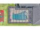 Aerial view of the pool with unique design and the pool is fully enclosed for privacy and safety at 6546 Eagle View Loop, Lakeland, FL 33813