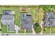 Aerial view of a property with a backyard featuring a pool, playground, and well-maintained landscaping at 6546 Eagle View Loop, Lakeland, FL 33813