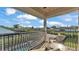 Balcony seating area with wrought iron railing and neighborhood views at 6546 Eagle View Loop, Lakeland, FL 33813