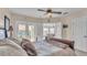 Bedroom with ceiling fan, and access to balcony with a seating area at 6546 Eagle View Loop, Lakeland, FL 33813