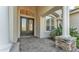 Elegant front entrance with decorative double doors, stately columns, and manicured landscaping, creating a grand welcome at 6546 Eagle View Loop, Lakeland, FL 33813