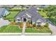 Beautiful single-story home with a manicured lawn and lovely landscaping and an inviting walkway at 6546 Eagle View Loop, Lakeland, FL 33813