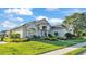 The exterior shows a well-maintained lawn and landscaping, and a stone paver walkway leads to the front door at 6546 Eagle View Loop, Lakeland, FL 33813