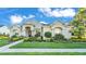 Charming single-story home featuring a beautifully landscaped yard and welcoming front entrance with classic architectural details at 6546 Eagle View Loop, Lakeland, FL 33813
