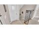Hallway with carpeted stairs and railing near a closed white door at 6546 Eagle View Loop, Lakeland, FL 33813