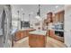 Spacious kitchen with a large island, stainless steel appliances, and access to the Gathering room at 6546 Eagle View Loop, Lakeland, FL 33813