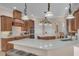 Modern kitchen with stainless steel appliances, quartz countertops, and a large island at 6546 Eagle View Loop, Lakeland, FL 33813