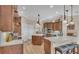 Bright kitchen with stainless steel appliances, kitchen island, and ample cabinet space at 6546 Eagle View Loop, Lakeland, FL 33813