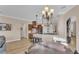 Open living space with view of kitchen with island, dining nook, and fireplace at 6546 Eagle View Loop, Lakeland, FL 33813