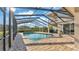 A screened-in pool area offers a relaxing oasis with ample space for lounging and outdoor enjoyment at 6546 Eagle View Loop, Lakeland, FL 33813