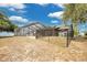 A fenced backyard includes a screened-in pool area and open space for recreation at 6750 Lemon Tree Dr, Lakeland, FL 33813