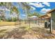 A fenced backyard featuring a screened-in pool area provides security and enjoyment at 6750 Lemon Tree Dr, Lakeland, FL 33813