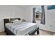 This bedroom features a full bed, a window and light-colored wood-look floors at 6750 Lemon Tree Dr, Lakeland, FL 33813
