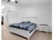 Bright bedroom features a large bed with a white headboard and a nightstand at 6750 Lemon Tree Dr, Lakeland, FL 33813