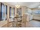 Bright dining area with neutral paint, large windows, and a contemporary chandelier at 6750 Lemon Tree Dr, Lakeland, FL 33813
