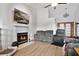 Cozy living room featuring a fireplace, vaulted ceilings, and wood flooring at 6750 Lemon Tree Dr, Lakeland, FL 33813