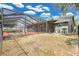 Screened-in pool and patio with a large backyard provides a private oasis for relaxation and outdoor activities at 6750 Lemon Tree Dr, Lakeland, FL 33813