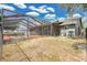 Screened-in pool and patio with a large backyard provides a private oasis for relaxation and outdoor activities at 6750 Lemon Tree Dr, Lakeland, FL 33813