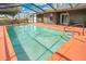 A sparkling pool with steps and a railing offers a cool escape on a sunny day at 6750 Lemon Tree Dr, Lakeland, FL 33813
