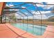 A screened-in pool area with a clear view of the yard and blue skies overhead at 6750 Lemon Tree Dr, Lakeland, FL 33813