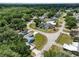 An aerial view of a neighborhood featuring lush greenery and well-maintained homes at 6810 Palomino Dr, Lakeland, FL 33811