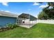 Backyard area displaying a carport next to the home and a well-kept lawn at 6810 Palomino Dr, Lakeland, FL 33811