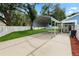 Backyard view showing a carport and a glimpse of the home's exterior at 6810 Palomino Dr, Lakeland, FL 33811