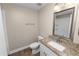 Bathroom features a granite countertop, modern sink and fixtures, and a decorative mirror at 6810 Palomino Dr, Lakeland, FL 33811