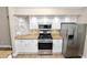 Well-equipped kitchen with stainless steel appliances, granite countertops, and modern backsplash at 6810 Palomino Dr, Lakeland, FL 33811