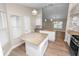 Bright kitchen features granite countertops, white cabinetry, and stainless steel appliances at 6810 Palomino Dr, Lakeland, FL 33811