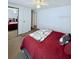 Comfortable bedroom featuring a full bed, a sliding door closet, and soft carpet at 816 Elizabeth Ln, Lakeland, FL 33809