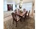 Elegant dining room with a wooden table, upholstered chairs, and modern lighting at 816 Elizabeth Ln, Lakeland, FL 33809