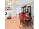 Inviting dining area featuring hardwood floors and a classic china cabinet at 816 Elizabeth Ln, Lakeland, FL 33809