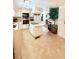 Bright kitchen with white cabinets, an island cooktop, and an expansive view into the dining area at 816 Elizabeth Ln, Lakeland, FL 33809