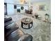 Spacious living room featuring a plush rug and an expansive view into the dining area at 816 Elizabeth Ln, Lakeland, FL 33809
