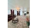 Cozy living room featuring a plush rug, leather sofa, and decorative coffee table at 816 Elizabeth Ln, Lakeland, FL 33809