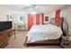 Bright bedroom with a plush bed, dresser, and TV, bathed in soft, natural light at 816 Elizabeth Ln, Lakeland, FL 33809