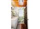 Bathroom with a wooden ceiling, colorful wallpaper, and a vanity sink at 921 Avon Ave, Lakeland, FL 33801