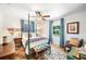 Comfortable bedroom with four-poster bed, stylish furnishings, and ample natural light at 921 Avon Ave, Lakeland, FL 33801