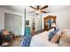 Cozy bedroom featuring neutral walls, a four poster bed, and decorative furnishings at 921 Avon Ave, Lakeland, FL 33801