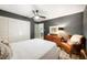 Bedroom featuring a ceiling fan, wood floors, and natural decor at 921 Avon Ave, Lakeland, FL 33801