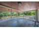 Spacious carport featuring a wood-paneled ceiling and providing ample covered parking and outdoor space at 921 Avon Ave, Lakeland, FL 33801