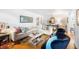 Bright living room featuring hardwood floors, a white sofa, and decorative furnishings at 921 Avon Ave, Lakeland, FL 33801