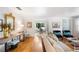 Open living room with hardwood floors, stylish decor, and an archway leading to the dining area at 921 Avon Ave, Lakeland, FL 33801