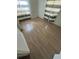 Bedroom showcasing light wood floors and natural light streaming through the windows at 930 E Tee Cir, Bartow, FL 33830