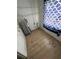Storage space featuring shelving, wood-look flooring, and water heater at 930 E Tee Cir, Bartow, FL 33830