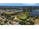 An aerial view shows the home's location in a lush neighborhood close to city amenities and nature spots at 1 Brogden Se Ct, Winter Haven, FL 33880